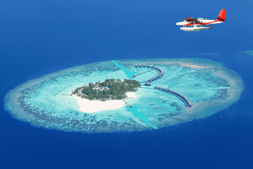 Vista aérea de ilha nas Maldivas com bangalôs sobre a água e hidroavião — turismo econômico e transporte acessível.